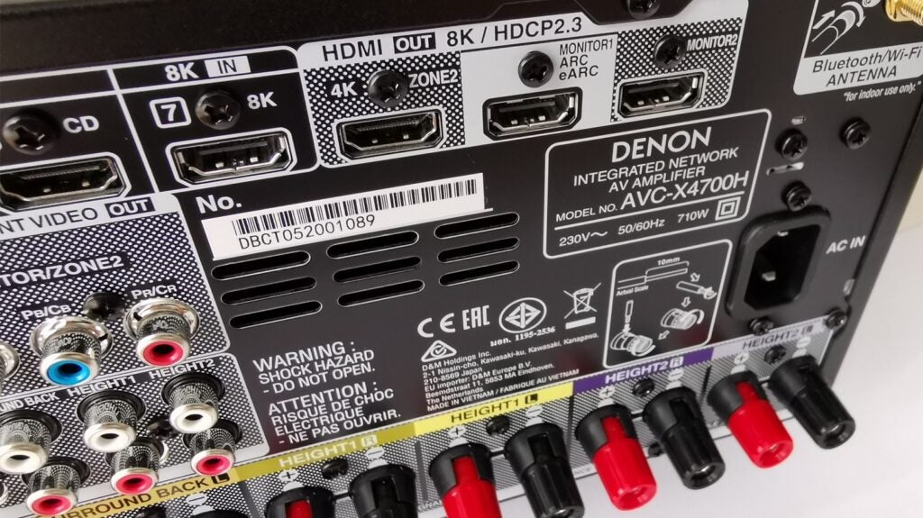 the back of the Denon amplifier system showing power connections to Hdmi