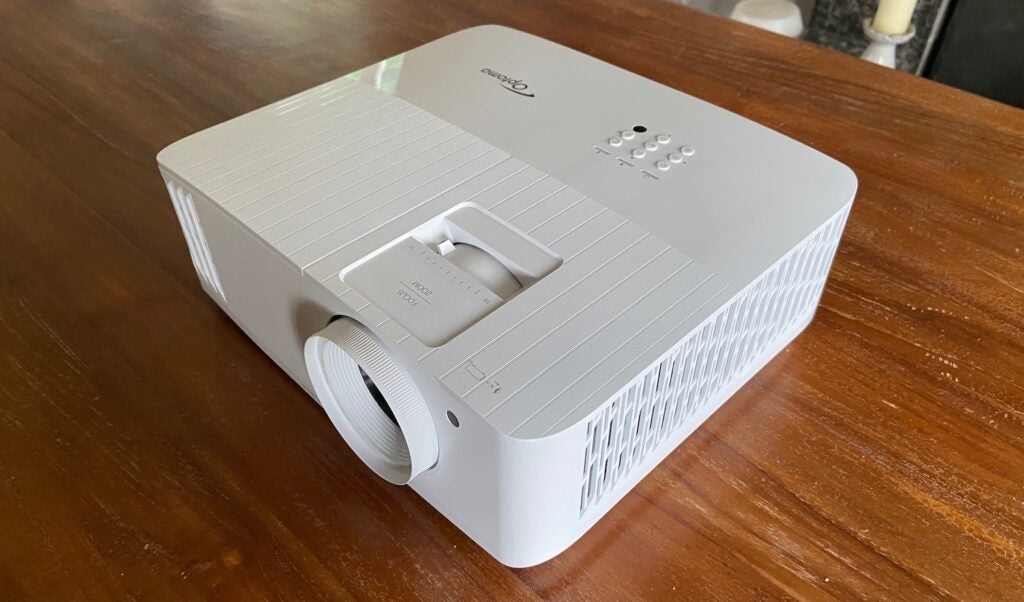 The Optoma UHD38 projector on a table