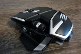 the other side view showing button, screw and notch on the gaming mouse
