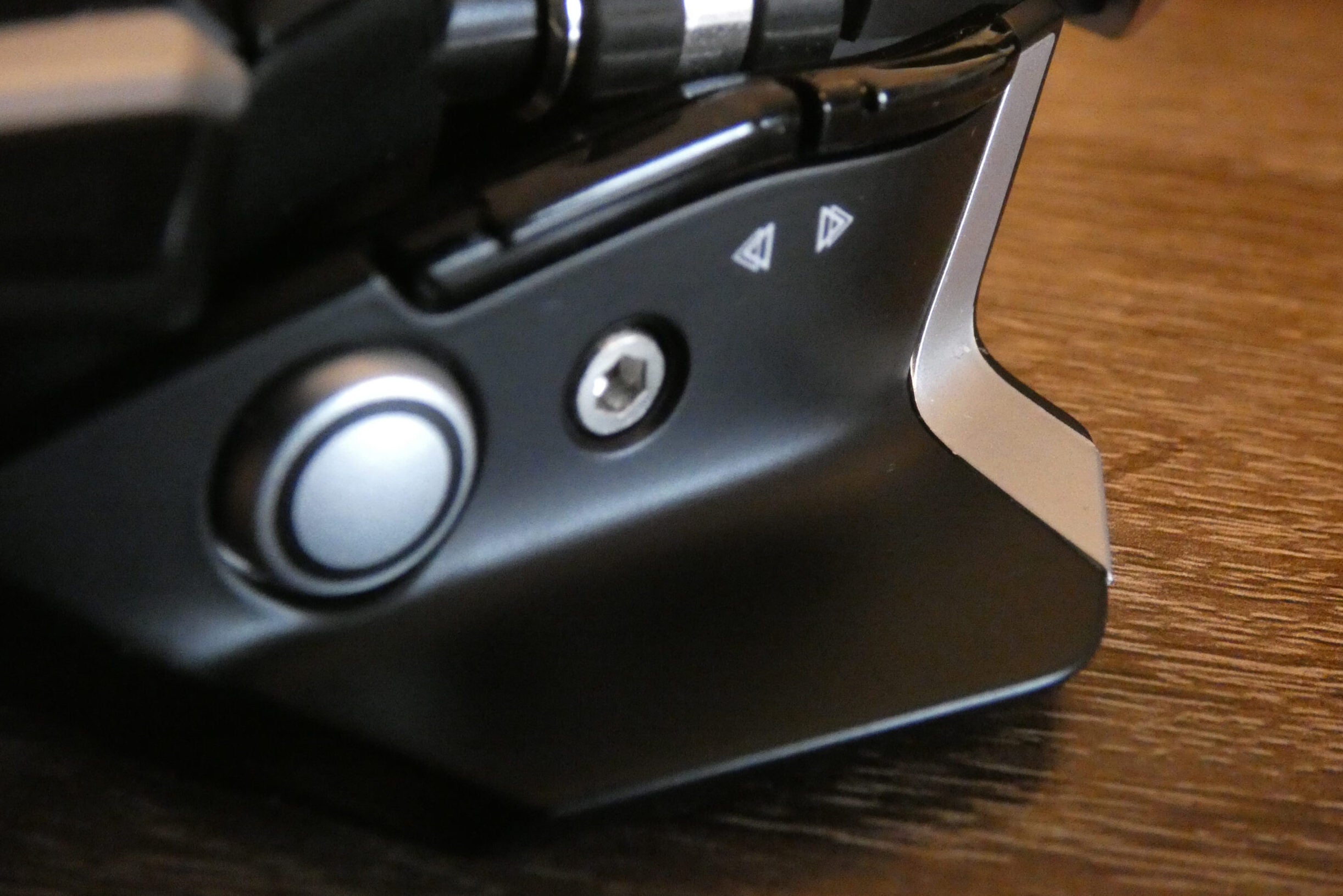 side view of gaming mouse with button and screw in sight
