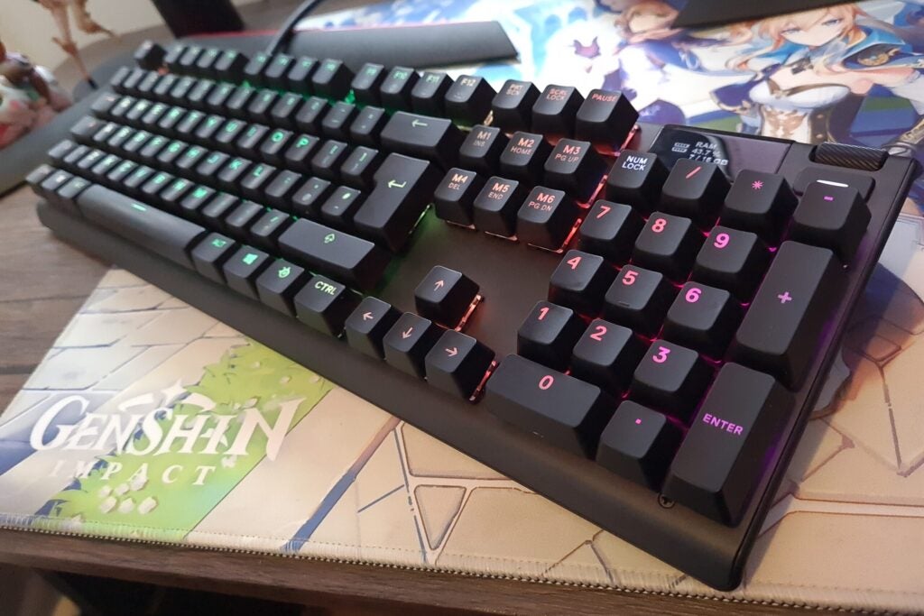 gaming keyboard with varying underneath light colors of purple and blue