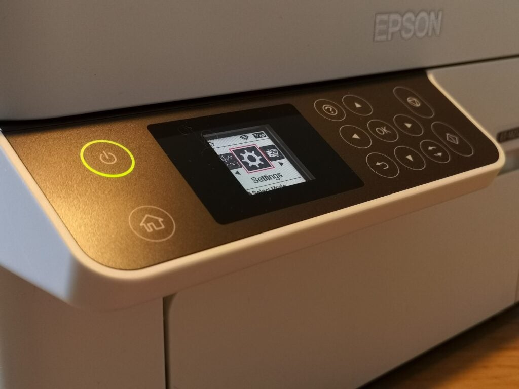 White clean Epson printer with a clear control panel view