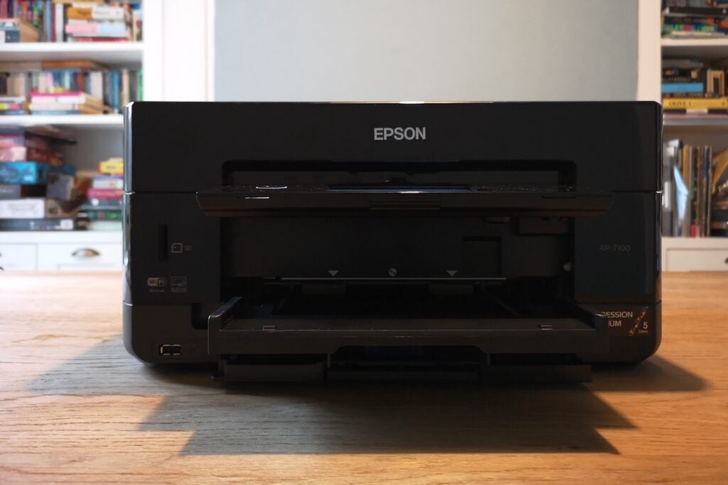Epson XP-7100Black Epson printer front view shwoing open paper tray and flat control panel