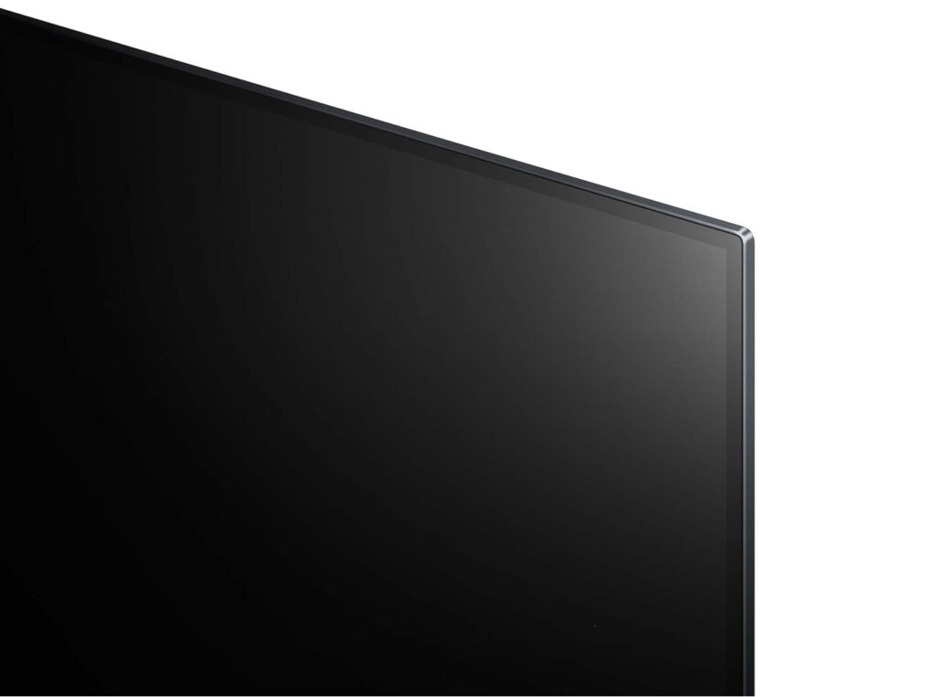 Top right corner view of a black LG OLED 65G1 TV on white background