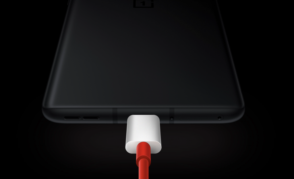 Bottom half view of One Plus 9R with charging cable connected