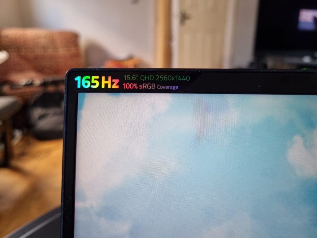 Razer Blade 15 base edition bezelTop left corner view of a black Razer blade 15 laptop with 165 Hz printed in rainbow color