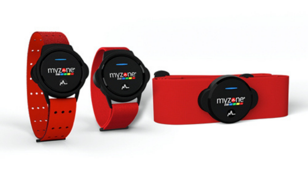 Myzone MZ-SwitchTwo red watches with black dial standing on a white background and a similar watch laid beside