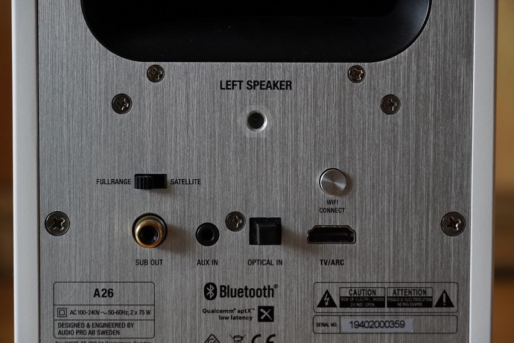 Back panel's port section view of a silver Audio Pro A26 speaker
