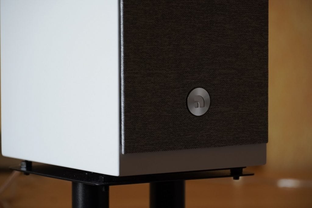 Close up image of front bottom part of balck Audio Pro A26 speaker