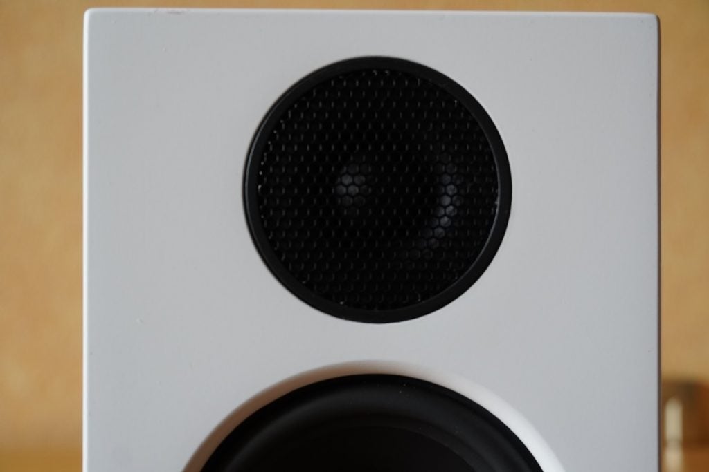Close up image of a black and white Audio Pro A26 Tweeter speaker