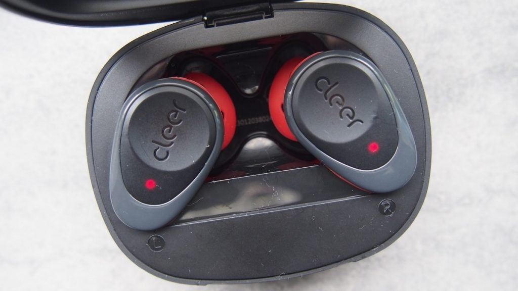 Cleer Goal headphones in caseBlack and red Cleer Goal earbuds resting in it's black case