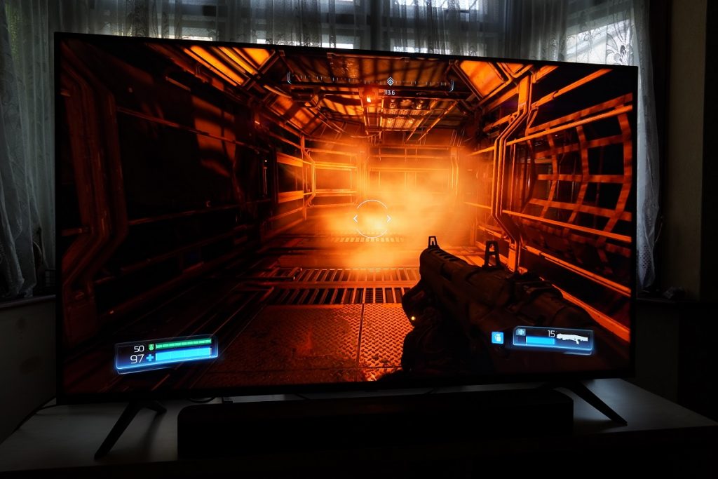 Hisense A7200G standing on table, displaying a scene from Doom game