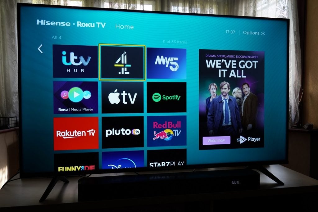 Hisense A7200G standing on table, displaying options on home screen to stream content