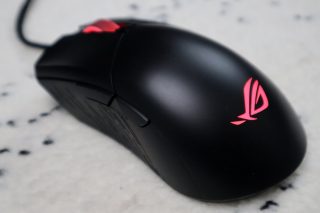 Top back view of a black ROG Gladius III mouse on a white background