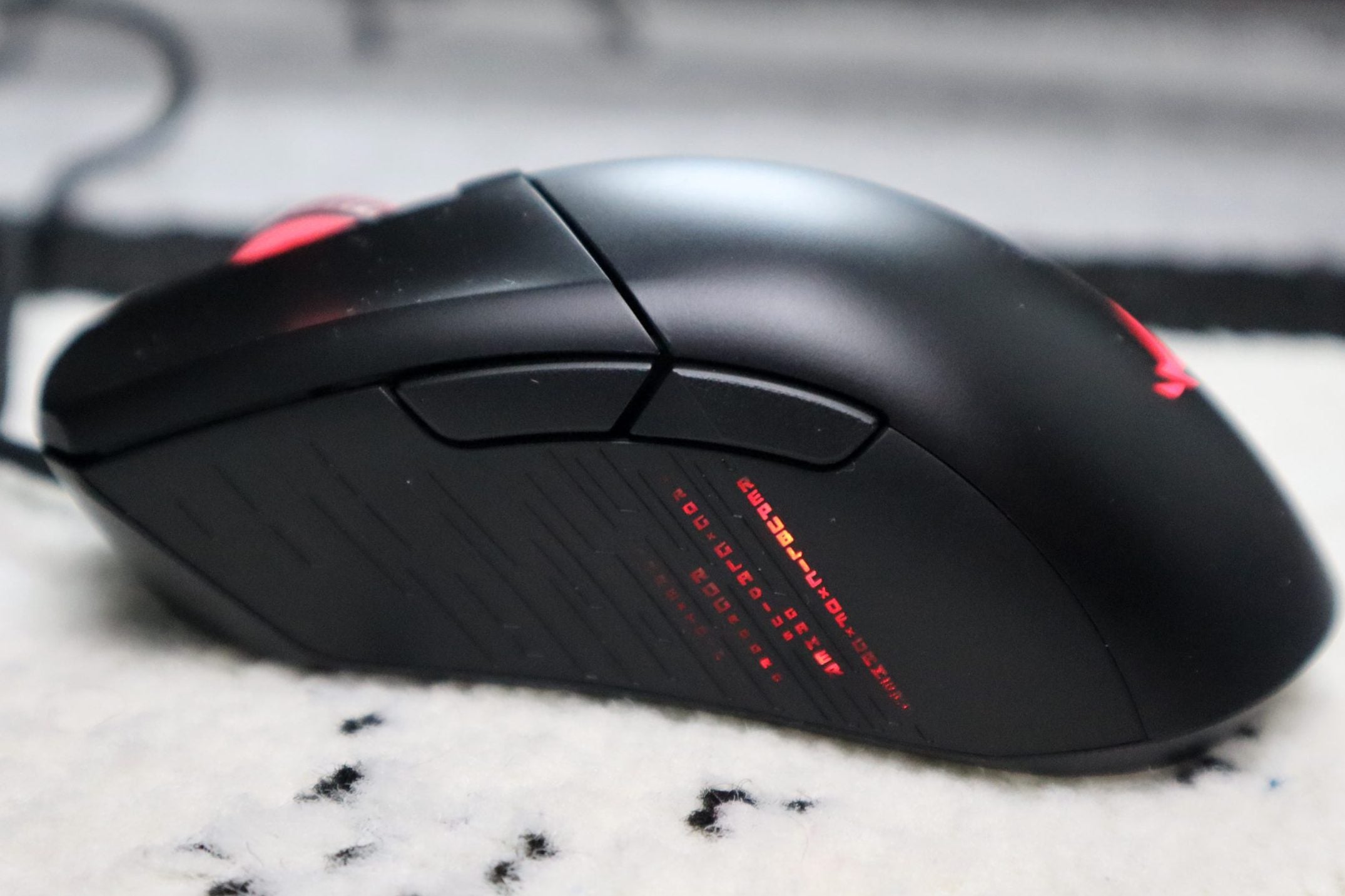Asus ROG Gladius III show on the side, with two buttons