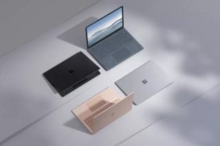 Four Surface laptop 4s in four different colors standing on a white  background