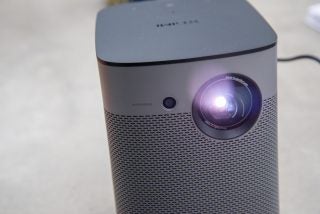 Close up image of a working XGIMI Halo 12 white projector