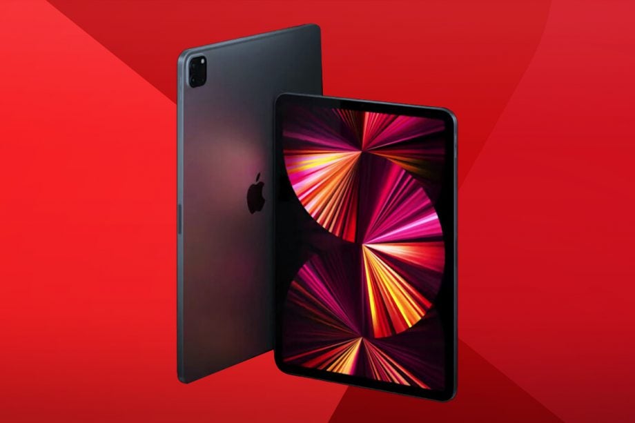 A gray iPad Pro with front and back panel visible, standing on a red background