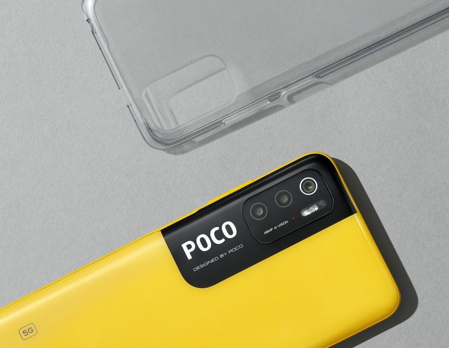 A half yellow Poco M3 pro's back view with three cameras aligned vertically on the left with flashligh on the side, and POCO written below in white on black background, placed on the bottom left, and it's transparent cover placed on top right, both placed parallel to each other
