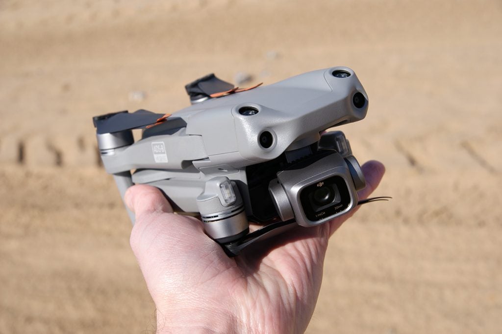 DJi Air 2s drone in the hand showing size