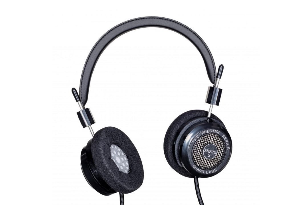 A black Grado SR225X headphone on a white background