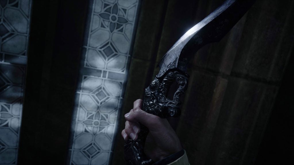 A scene from Resident Evil Village game, a man holding a black dagger in his hand