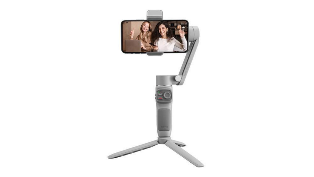 Zhiyun Smooth Q3A silver Smooth Q3 Gimble stabilizer held in hand with an iPhone attached to it, displaying two women laughing and drinking coffe