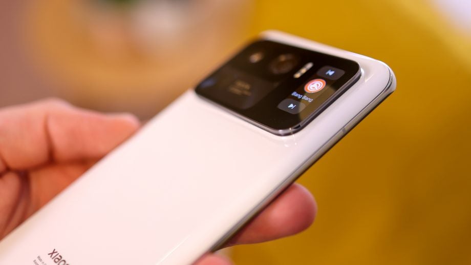 Close up image of back side of Mi 11 Ultra Pro, mini screen on the right side of camera at the back displaying the curently playing music with a next and previous button above and below it