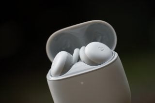 White Google Pixel Buds resting in the case