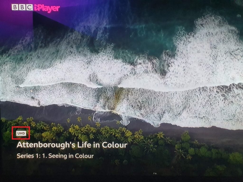 Picture of an island from top displayed via BBC iPlayer with its logo at top left and UHD, Attenborough's Life in Colour at bottom left