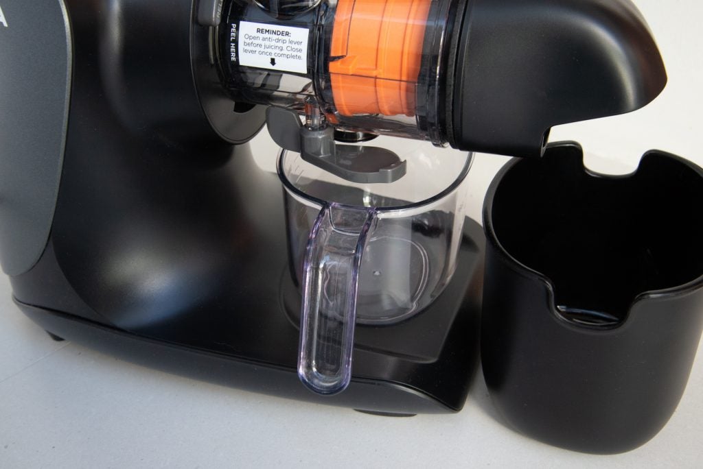 Ninja Cold Press Juicer JC100UK with orange juice extraction.