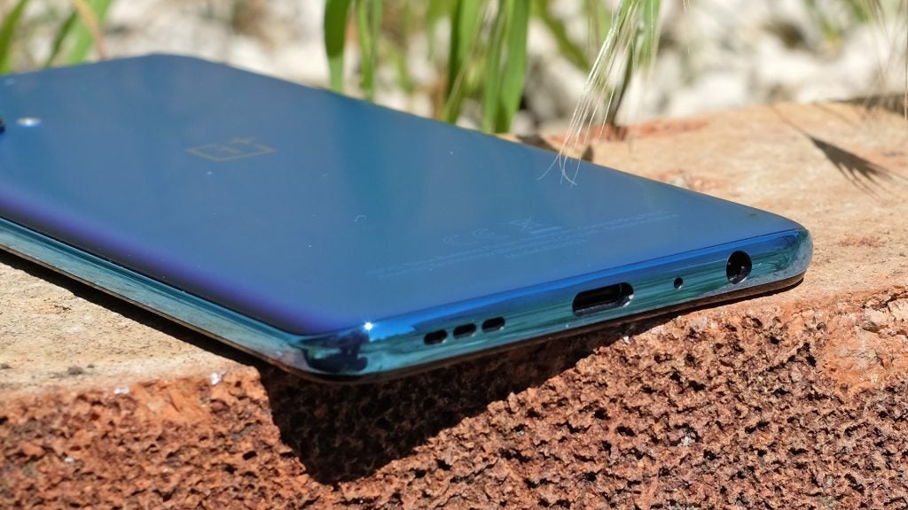 The OnePlus Nord CE 5G USB-C portBottom back view of a blue One Plus Nord CE 5G 6 resting upside down on top of the wall