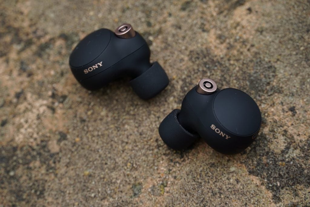Sony WF-1000XM4 earbuds placed on ground