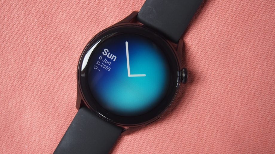 Huawei Watch 3 showing the a clock face and screen on