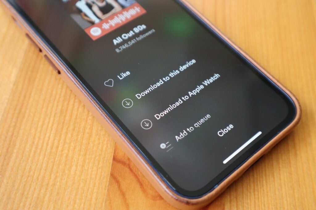 Tap 'download to Apple Watch' to begin downloading the songs
