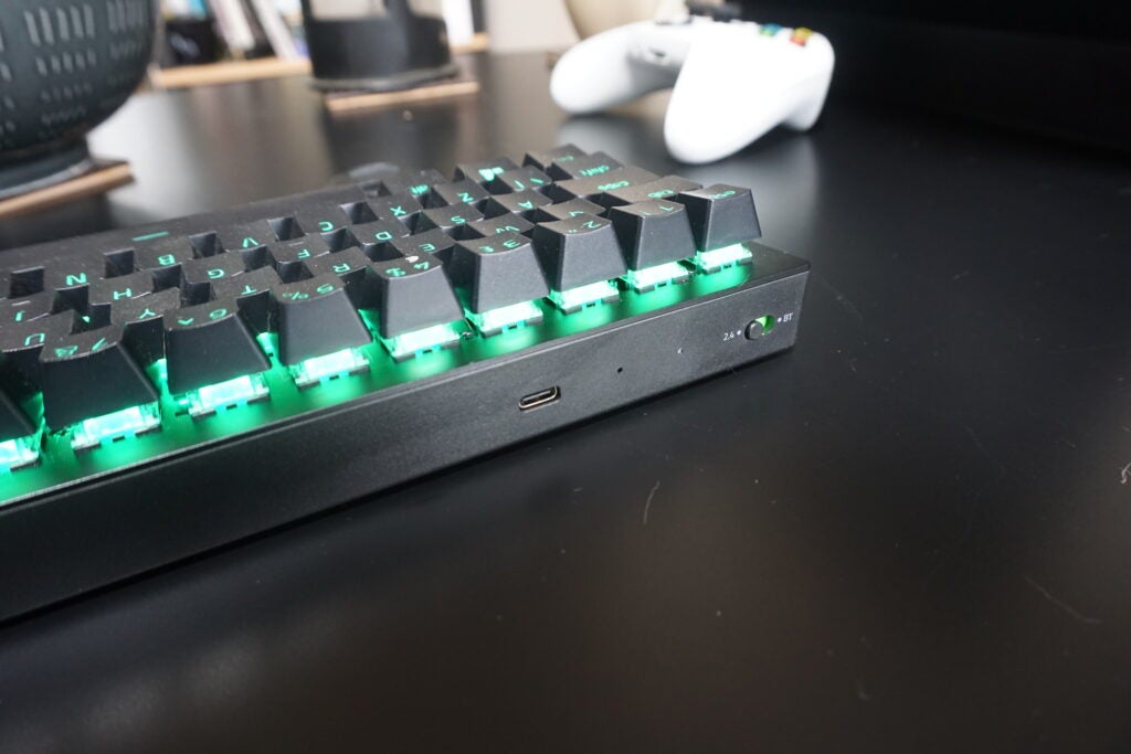 Razer BlackWidow V3 Mini mechanical keyboard with green backlight.