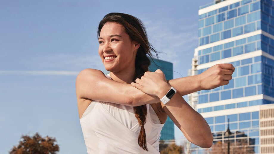 A lifestyle shot of the Fitbit Charge 5 in use