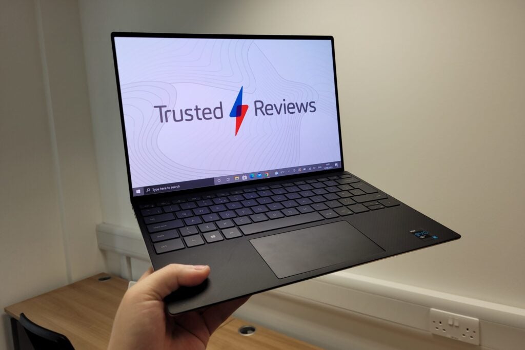 Dell XPS 13 OLED being held