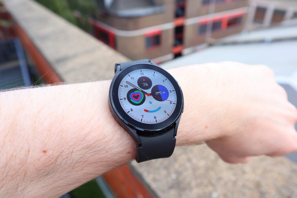 A traditional Galaxy Watch 4 watch face with several complications