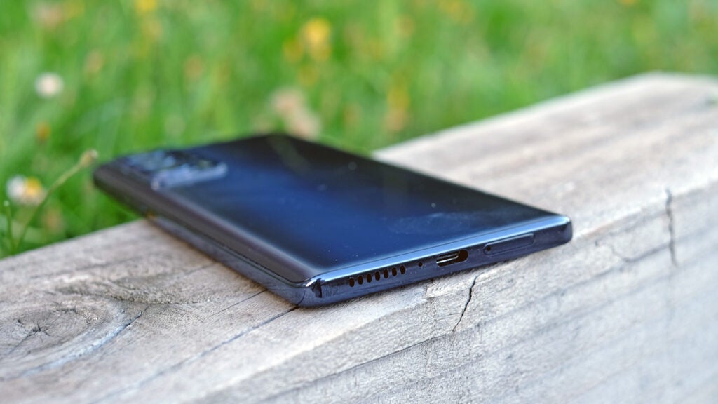 Motorola Edge 20 Pro smartphone on a wooden surface.
