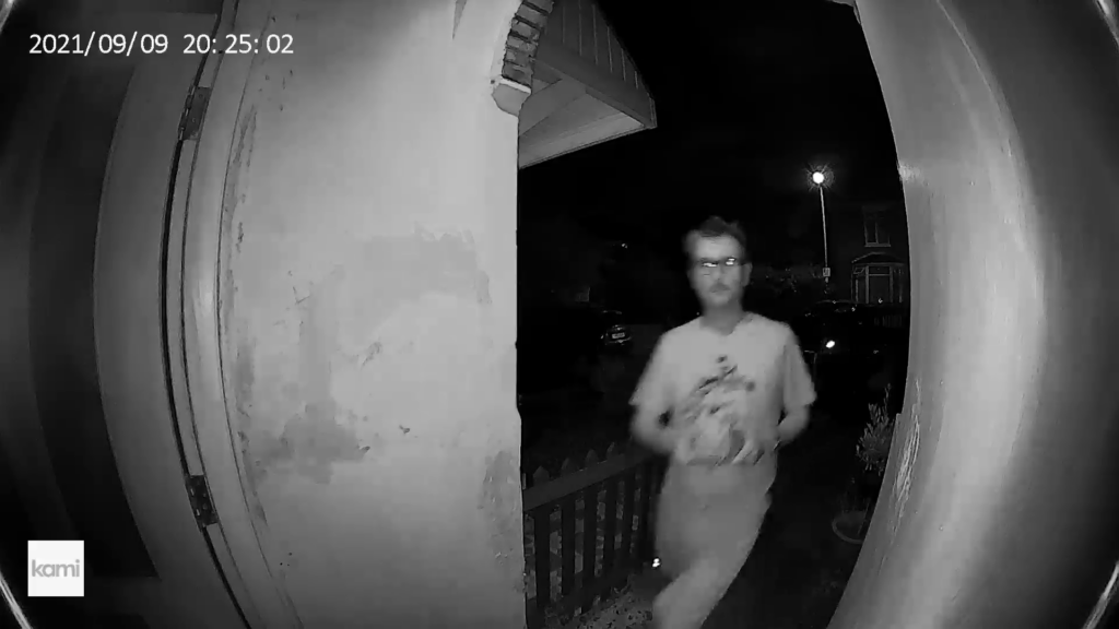 Night vision footage from Kami Doorbell Camera showing a person.