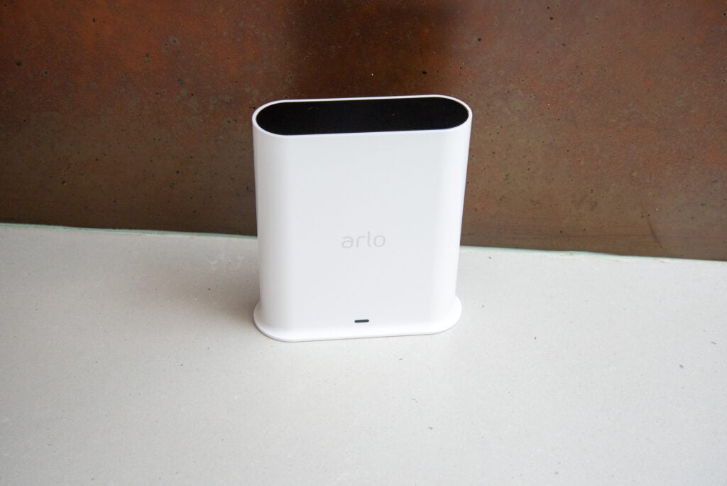 Arlo Ultra 2 camera smart hub on concrete surface