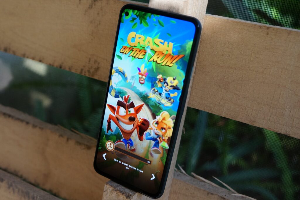 Google Pixel 5a displaying a colorful mobile game screen.