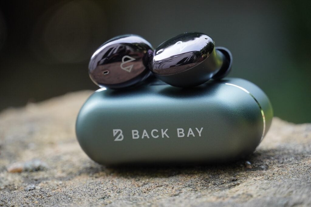 Back Bay Tempo 30 earbuds on top of charging case