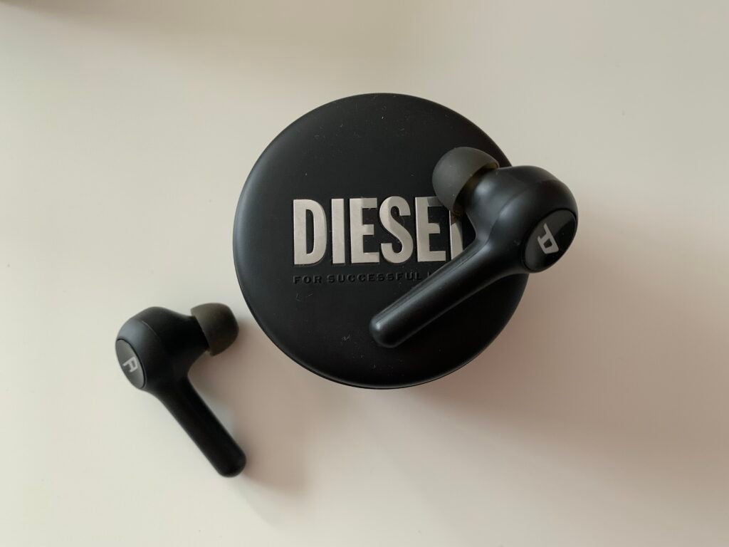 Diesel True Wireless Earbuds on top of case