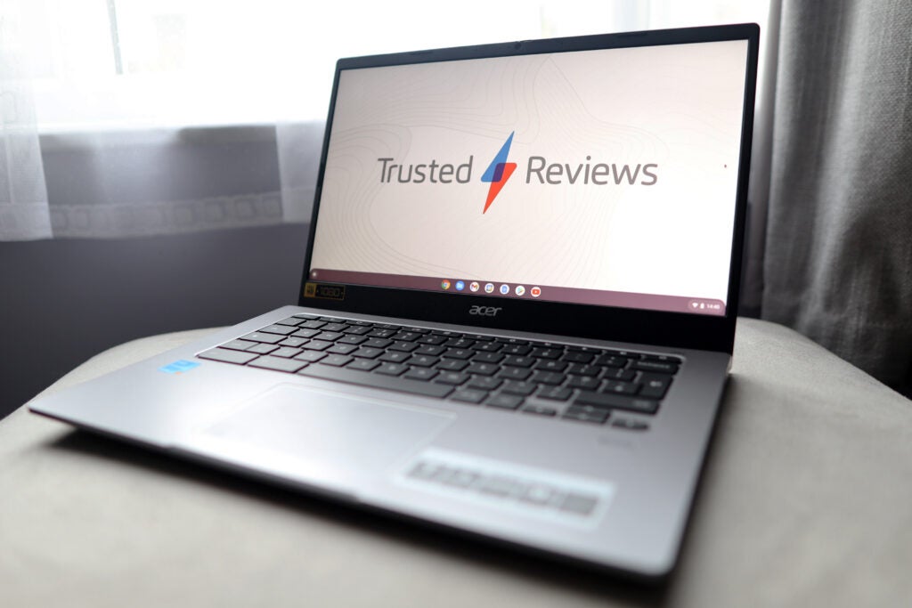 The Acer Chromebook 514 with a Trusted Reviews wallpaper