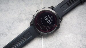 Garmin Fenix 7 watch displaying 5K running prediction time.