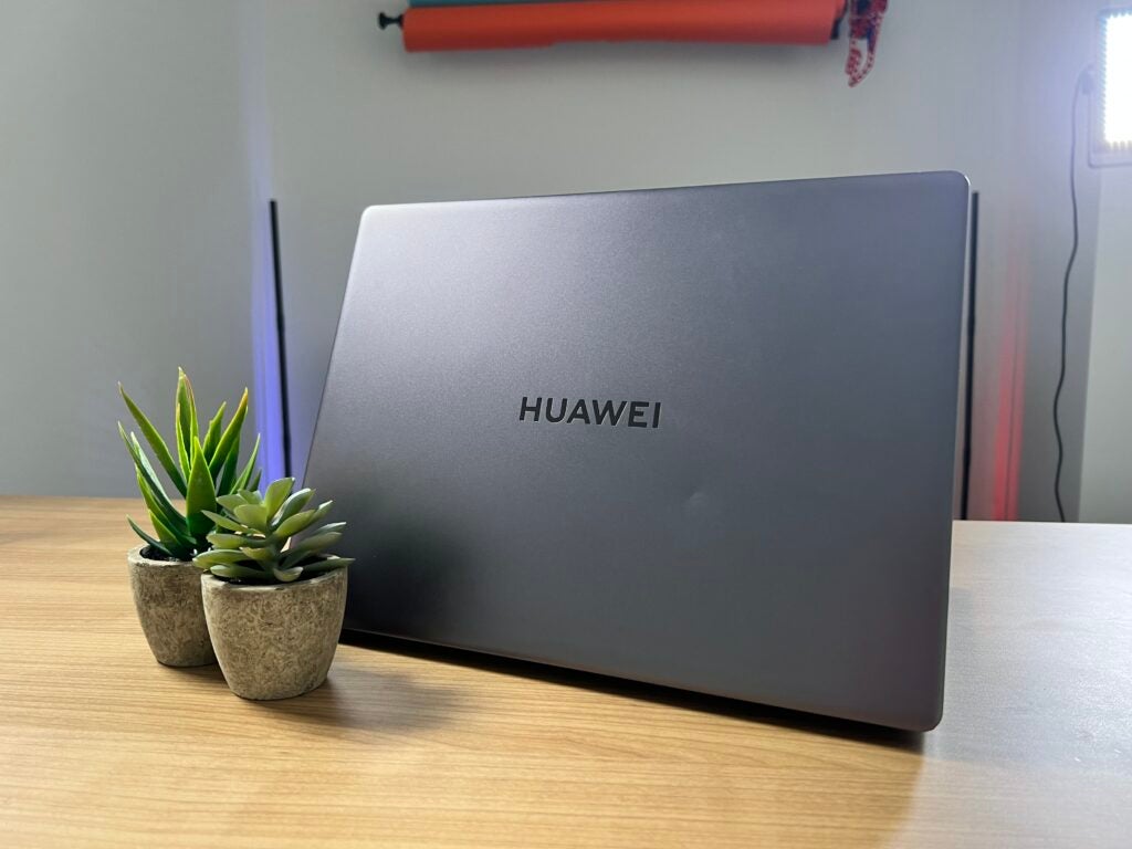 Huawei MateBook 14s lid, next to small plant