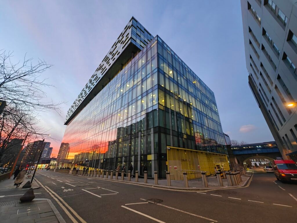 Ultrawide image of reflected sunset on glass building taken by Huawei P50 Pocket