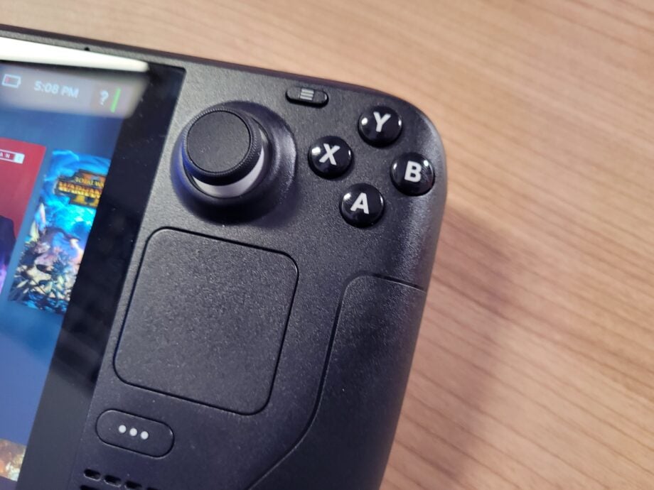 Close-up of a Steam Deck gaming handheld device's controls.